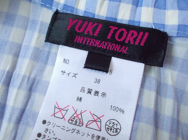 買取したユキトリイのブルーのギンガムチェックのジャケットのタグ