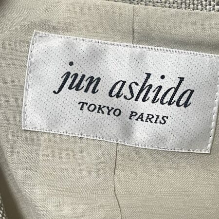 買取したジュンアシダのコートのタグ